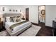 Main bedroom with ensuite bathroom and dark wood floors at 10040 E Happy Valley Rd # 512, Scottsdale, AZ 85255