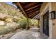 Elegant entryway with wrought iron doors and stone flooring at 10040 E Happy Valley Rd # 512, Scottsdale, AZ 85255