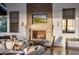Ornate fireplace with a built-in TV and mountain views at 10040 E Happy Valley Rd # 512, Scottsdale, AZ 85255