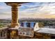 Outdoor kitchen with a built-in grill and mountain views at 10040 E Happy Valley Rd # 512, Scottsdale, AZ 85255
