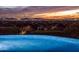 Stunning infinity pool overlooking city lights at sunset at 10040 E Happy Valley Rd # 512, Scottsdale, AZ 85255