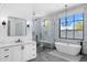 Luxurious bathroom with soaking tub, walk-in shower, and marble finishes at 11438 N 70Th St, Scottsdale, AZ 85254