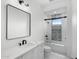 Modern bathroom with white vanity, bathtub, and stylish fixtures at 11438 N 70Th St, Scottsdale, AZ 85254