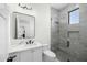 Elegant bathroom with a grey tiled shower, white vanity, and quartz countertop at 11438 N 70Th St, Scottsdale, AZ 85254