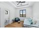 Bright bedroom with light wood floors and en-suite bathroom at 11438 N 70Th St, Scottsdale, AZ 85254