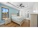 Charming bedroom with light blue walls, a comfy bed, and wood flooring at 11438 N 70Th St, Scottsdale, AZ 85254