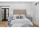 Spacious bedroom with king-size bed, fireplace, and French doors leading to a patio at 11438 N 70Th St, Scottsdale, AZ 85254
