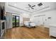 Spacious main bedroom with hardwood floors and sliding barn door at 11438 N 70Th St, Scottsdale, AZ 85254