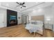 Bright bedroom with a king-size bed, fireplace and hardwood floors at 11438 N 70Th St, Scottsdale, AZ 85254