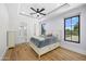 Spacious bedroom with lavender walls, a plush bed, and access to a bathroom at 11438 N 70Th St, Scottsdale, AZ 85254