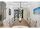 Bright dining room with large doors opening to backyard at 11438 N 70Th St, Scottsdale, AZ 85254