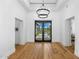 Elegant dining room with hardwood floors and double doors leading outside at 11438 N 70Th St, Scottsdale, AZ 85254