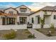 Farmhouse exterior with pergola, landscaping, and gated entry at 11438 N 70Th St, Scottsdale, AZ 85254
