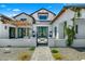 Stunning farmhouse exterior with a paved pathway and lush landscaping at 11438 N 70Th St, Scottsdale, AZ 85254