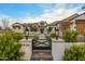 Farmhouse exterior with walkway, landscaping, and gated entry at 11438 N 70Th St, Scottsdale, AZ 85254
