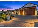 Large wooden garage doors and a paved driveway at 11438 N 70Th St, Scottsdale, AZ 85254