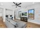 Bright Gathering room features a comfy sectional sofa, built-in workspace, and large windows at 11438 N 70Th St, Scottsdale, AZ 85254