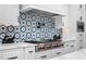 Stylish kitchen with geometric backsplash and stainless steel range at 11438 N 70Th St, Scottsdale, AZ 85254