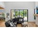 Spacious living room with sectional sofa, large windows, and backyard view at 11438 N 70Th St, Scottsdale, AZ 85254