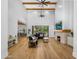 Open living area with a fireplace and large sliding glass doors to backyard at 11438 N 70Th St, Scottsdale, AZ 85254