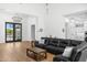Bright living room featuring a sectional sofa and hardwood floors, with view to backyard at 11438 N 70Th St, Scottsdale, AZ 85254