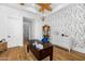Home office with wood floors and charming wallpaper at 11438 N 70Th St, Scottsdale, AZ 85254