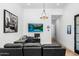 Home office with hardwood floors, large screen TV and comfortable seating at 11438 N 70Th St, Scottsdale, AZ 85254