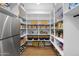 Well-organized pantry with ample shelving and space for storage at 11438 N 70Th St, Scottsdale, AZ 85254