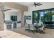 Outdoor patio with built-in grill, dining area, and seating at 11438 N 70Th St, Scottsdale, AZ 85254