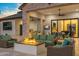 Relaxing outdoor patio with fire pit, seating, and built-in grill at 11438 N 70Th St, Scottsdale, AZ 85254