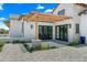 Covered patio with pergola, brick and white exterior, and a paved pathway at 11438 N 70Th St, Scottsdale, AZ 85254