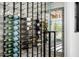 Modern wine cellar with glass door and brick wall at 11438 N 70Th St, Scottsdale, AZ 85254
