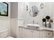 Modern bathroom with white cabinets and tiled walls at 11885 N Sunset Vista Dr, Fountain Hills, AZ 85268