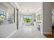 Luxurious bathroom with marble floors, soaking tub, and large window at 11885 N Sunset Vista Dr, Fountain Hills, AZ 85268