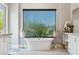 Bathroom featuring a free-standing tub and large window at 11885 N Sunset Vista Dr, Fountain Hills, AZ 85268