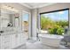 Bathroom with free-standing tub and pool view at 11885 N Sunset Vista Dr, Fountain Hills, AZ 85268