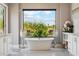 Bathroom with a free-standing tub and view of the backyard at 11885 N Sunset Vista Dr, Fountain Hills, AZ 85268