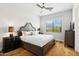 Bright bedroom featuring a comfortable bed and hardwood floors at 11885 N Sunset Vista Dr, Fountain Hills, AZ 85268