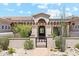 Stunning home exterior with arched entryway and landscaping at 11885 N Sunset Vista Dr, Fountain Hills, AZ 85268