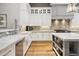 Bright kitchen boasts white cabinets, marble counters, and a center island at 11885 N Sunset Vista Dr, Fountain Hills, AZ 85268