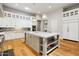 Modern kitchen with a large island, white cabinets, and a marble countertop at 11885 N Sunset Vista Dr, Fountain Hills, AZ 85268