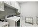 Laundry room with modern washer, dryer and ample storage at 11885 N Sunset Vista Dr, Fountain Hills, AZ 85268