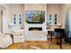 Bright living room featuring a fireplace and hardwood floors at 11885 N Sunset Vista Dr, Fountain Hills, AZ 85268
