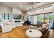 Spacious living room with fireplace, hardwood floors, and large windows at 11885 N Sunset Vista Dr, Fountain Hills, AZ 85268