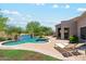 Inviting kidney-shaped pool with brick accents and lounge chairs at 11885 N Sunset Vista Dr, Fountain Hills, AZ 85268