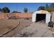 Backyard with shed, gravel, and chain link fence at 12405 W Via Camille --, El Mirage, AZ 85335