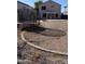 Backyard with trampoline and dry grass at 12405 W Via Camille --, El Mirage, AZ 85335