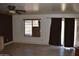 Living area with sliding door and window at 12405 W Via Camille --, El Mirage, AZ 85335