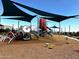 Community playground with shaded areas for play at 13137 E Verbina Ln, Florence, AZ 85132