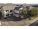 Two-story house with driveway and landscaping, aerial view at 1340 E Kingman Pl, Casa Grande, AZ 85122